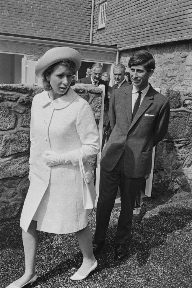 king charles walks behind princess anne