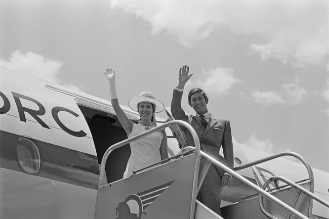 princess anne and king charles wave from a plane