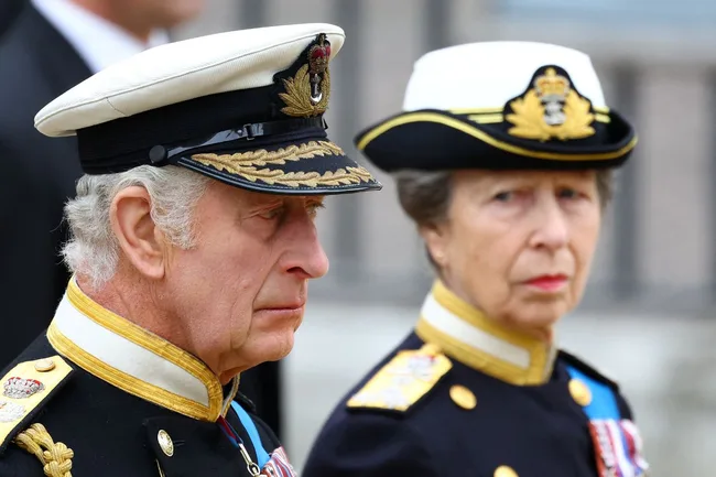 princess anne and king charles look sad as they stand at their mothers funeral