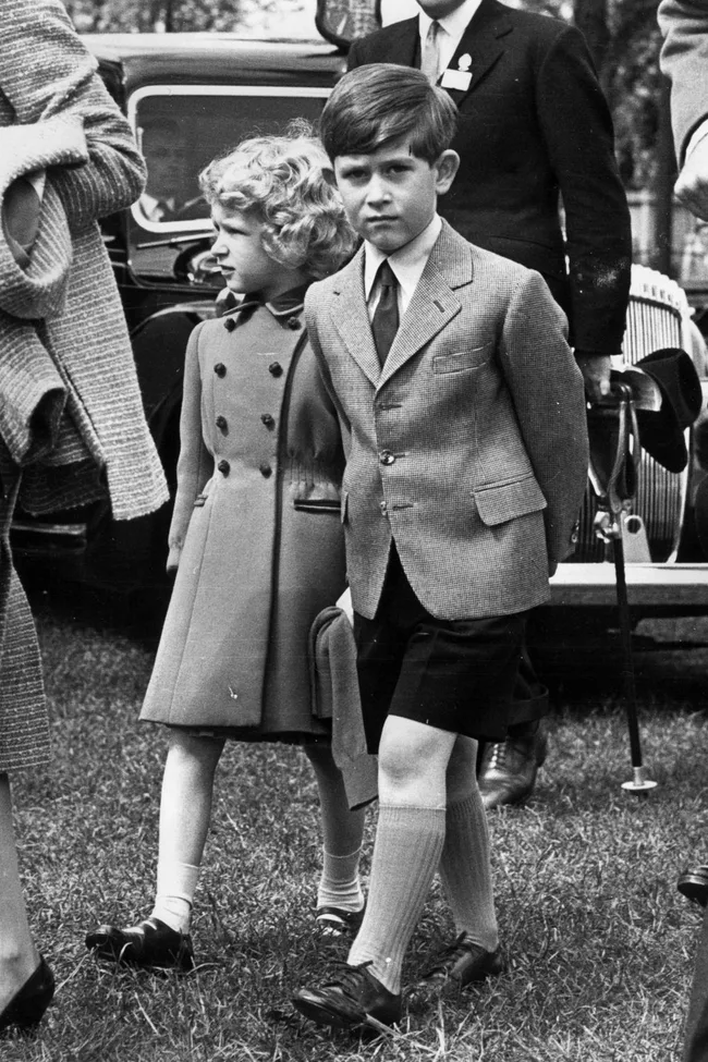 princess anne and king charles walking side by side