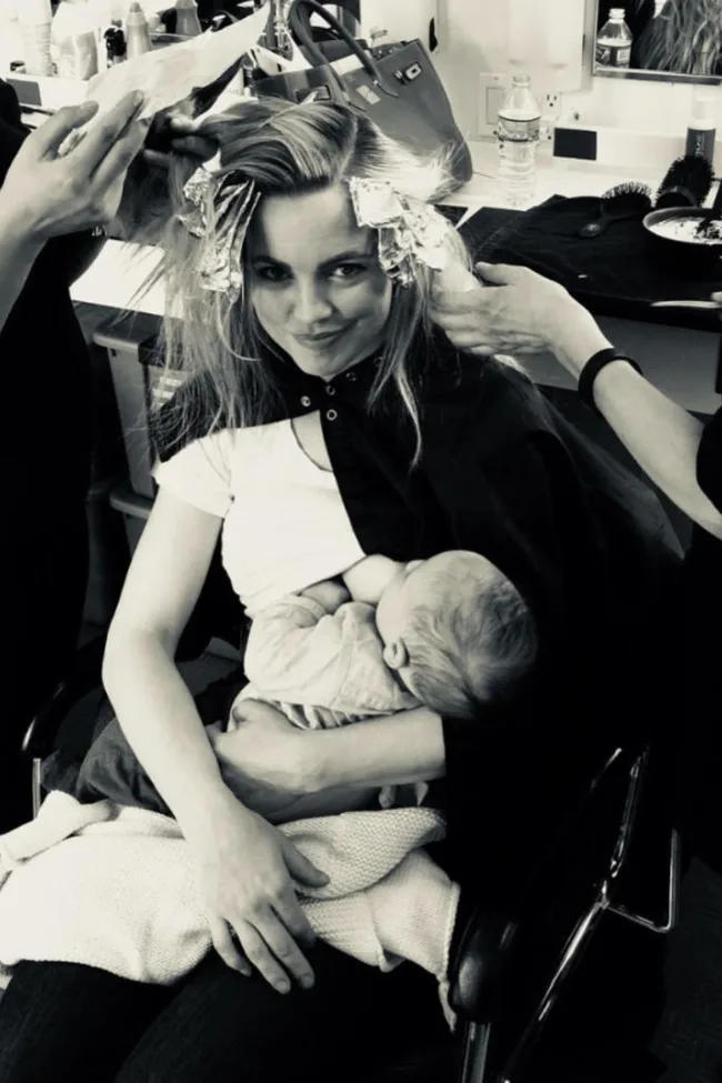 melissa george breastfeeding her son as she gets her hair dyed