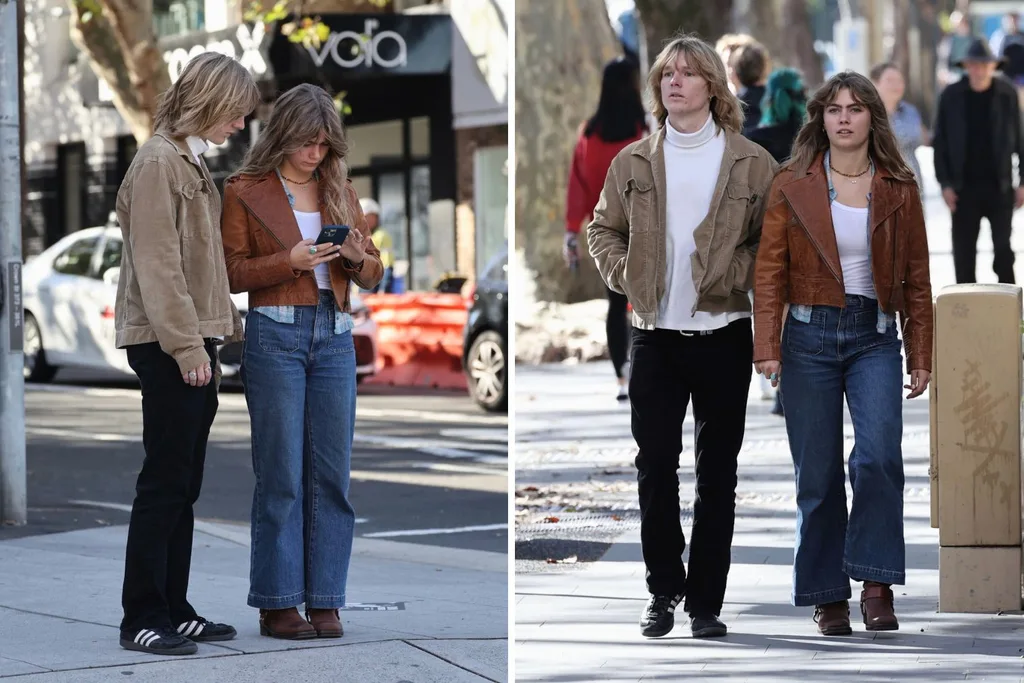 mia hewitt walks the street alongside a friend