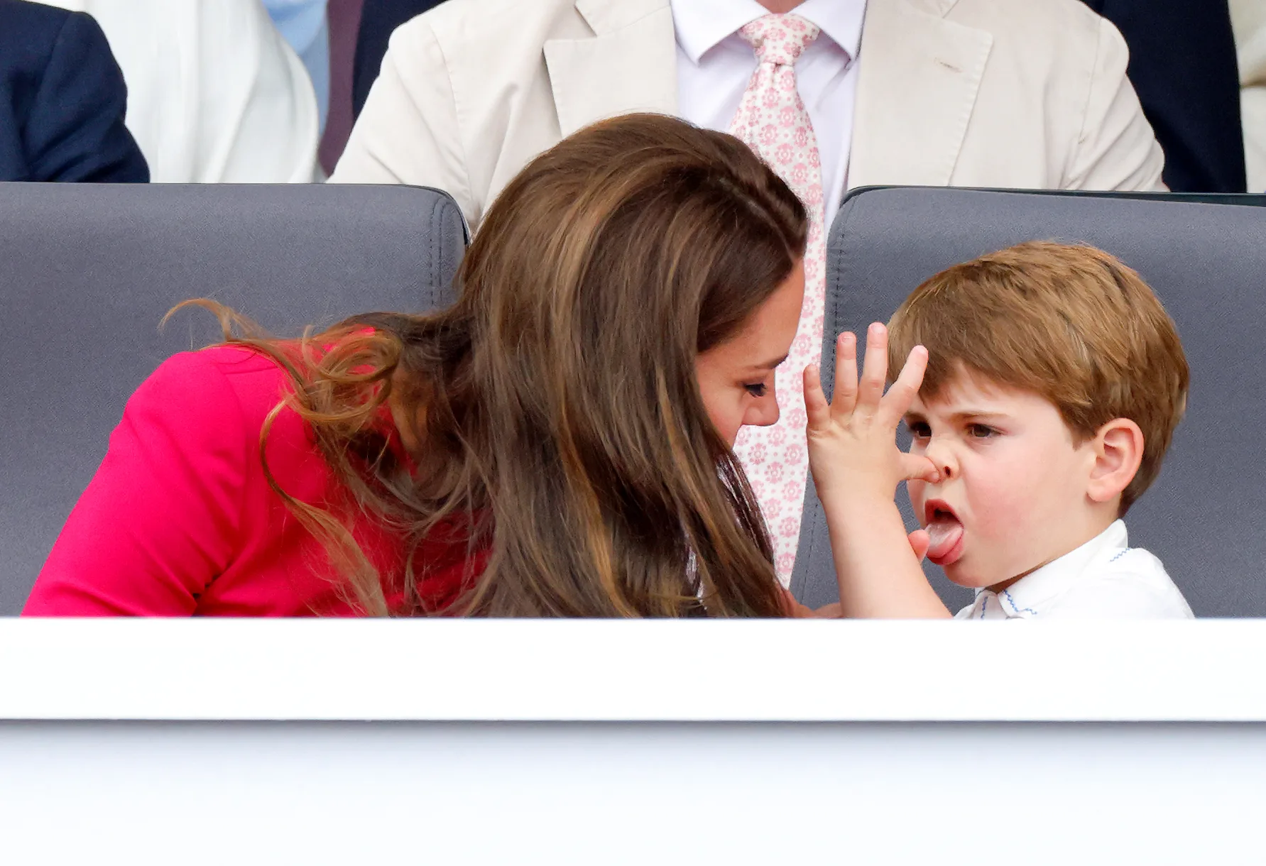 LONDON, UNITED KINGDOM - JUNE 05: (EMBARGOED FOR PUBLICATION IN UK NEWSPAPERS UNTIL 24 HOURS AFTER CREATE DATE AND TIME) Prince Louis of Cambridge 'thumb's his nose' and sticks his tongue out at his mother Catherine, Duchess of Cambridge as they attend the Platinum Pageant on The Mall on June 5, 2022 in London, England. The Platinum Jubilee of Elizabeth II is being celebrated from June 2 to June 5, 2022, in the UK and Commonwealth to mark the 70th anniversary of the accession of Queen Elizabeth II on 6 February 1952. (Photo by Max Mumby/Indigo/Getty Images)