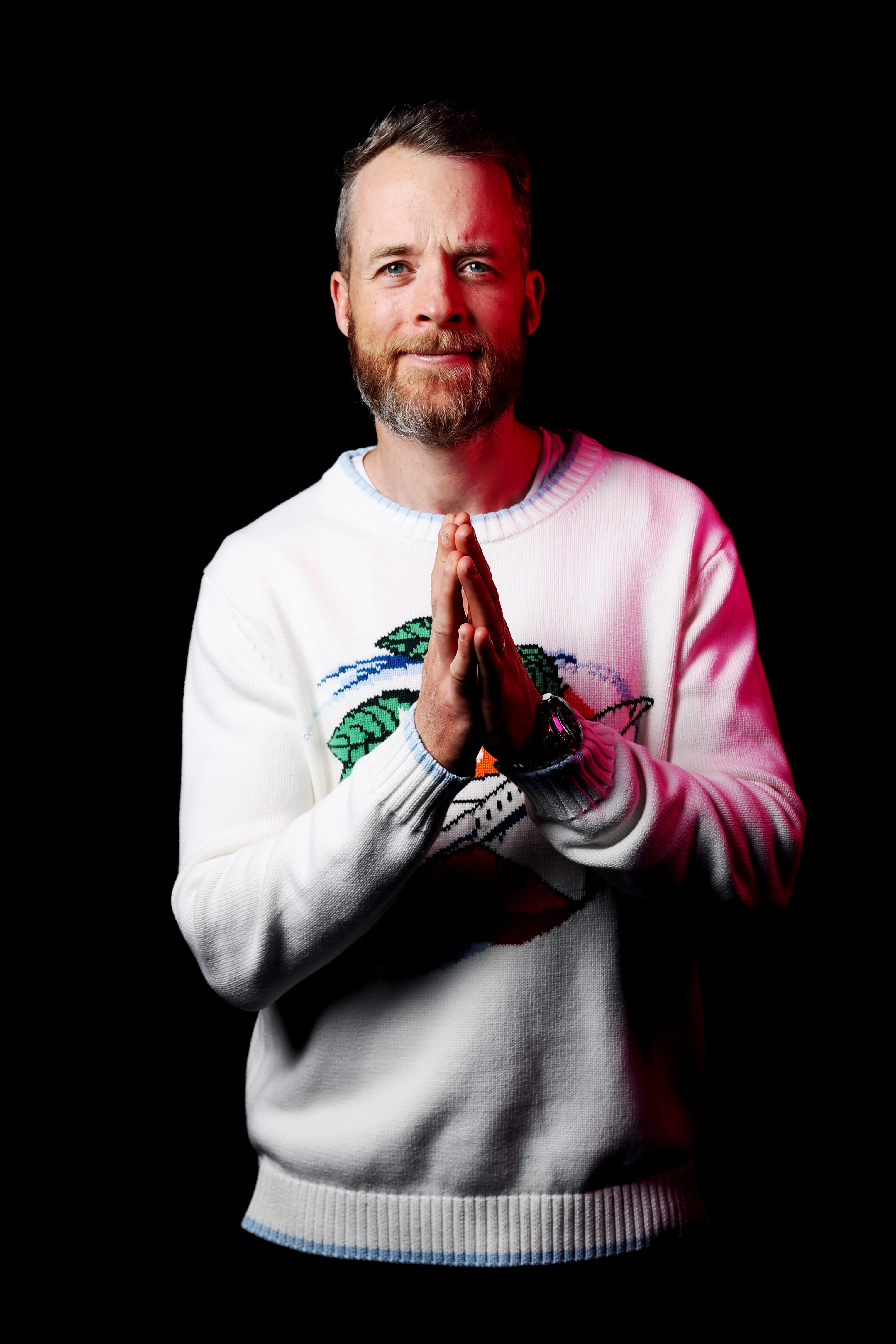 hamish blake grey jumper black background