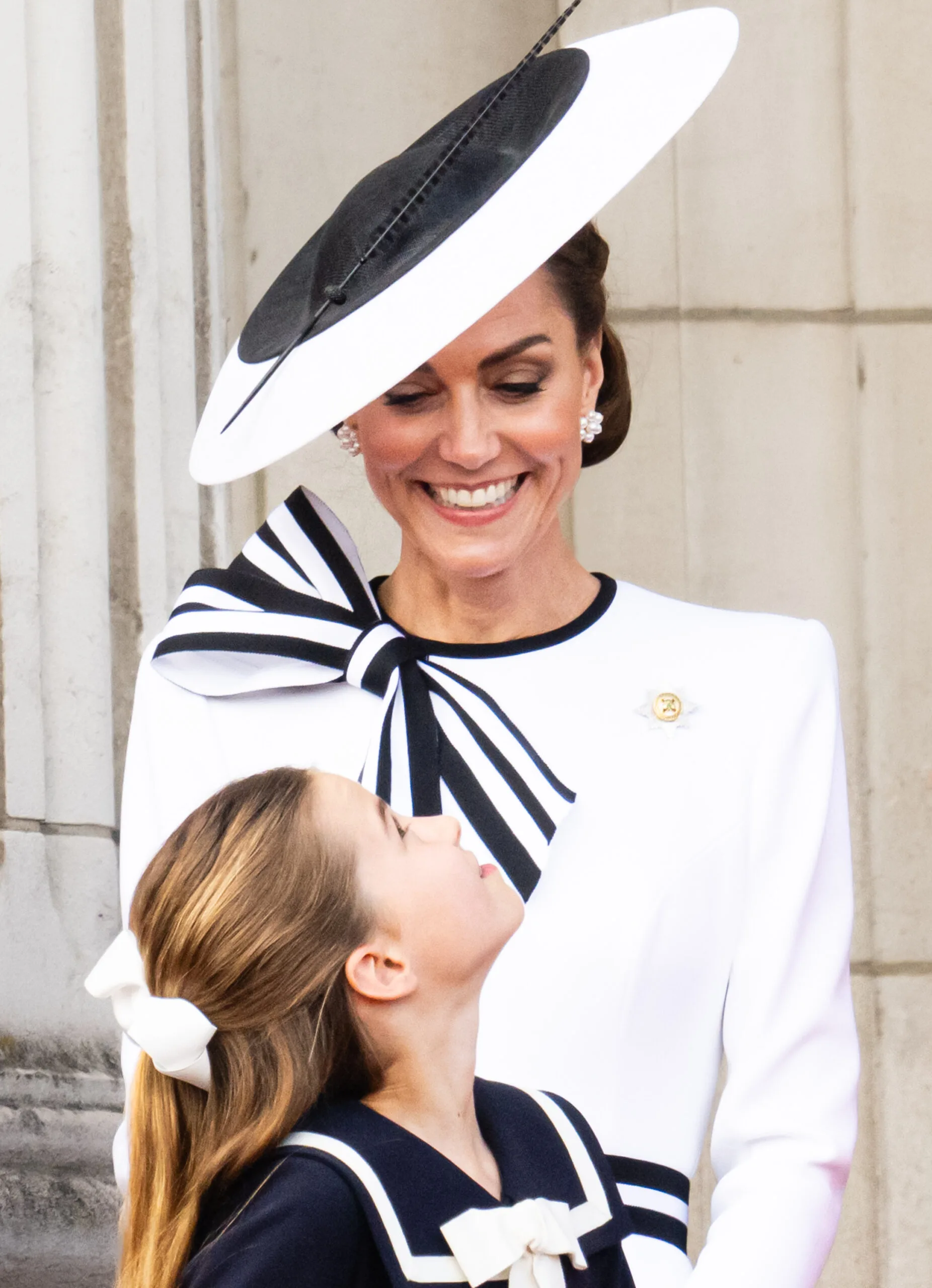 LONDON, ENGLAND - JUNE 15: Catherine, Princess of Wales and Princess Charlotte of Wales during Trooping the Colour on June 15, 2024 in London, England. Trooping the Colour is a ceremonial parade celebrating the official birthday of the British Monarch. The event features over 1,400 soldiers and officers, accompanied by 200 horses. More than 400 musicians from ten different bands and Corps of Drums march and perform in perfect harmony. (Photo by Samir Hussein/WireImage)