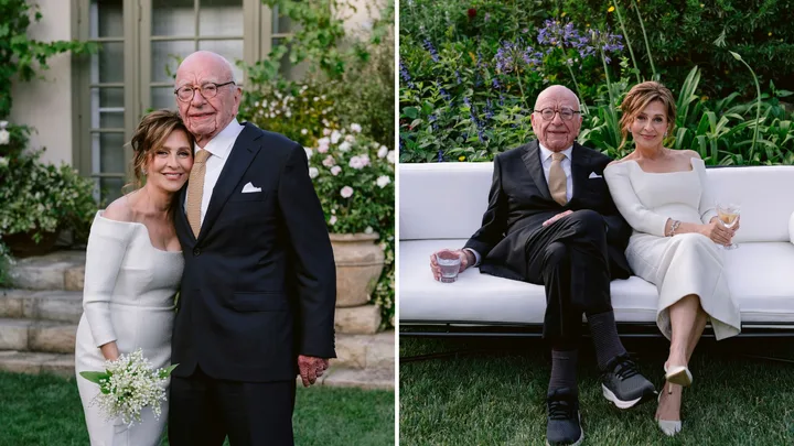 An elderly couple in formal attire, posing in a garden setting. They appear to be attending a special occasion.