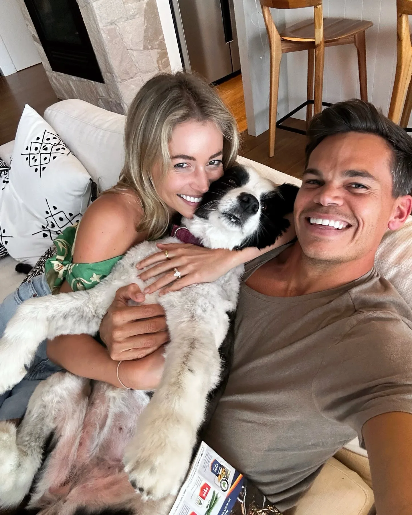 holly kingston jimmy nicholson on the lounge with a dog