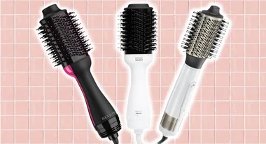 Three hair dryer brushes on a pink tiled background: Revlon black/pink, Bondi Boost white, and a white brush with metal tip.