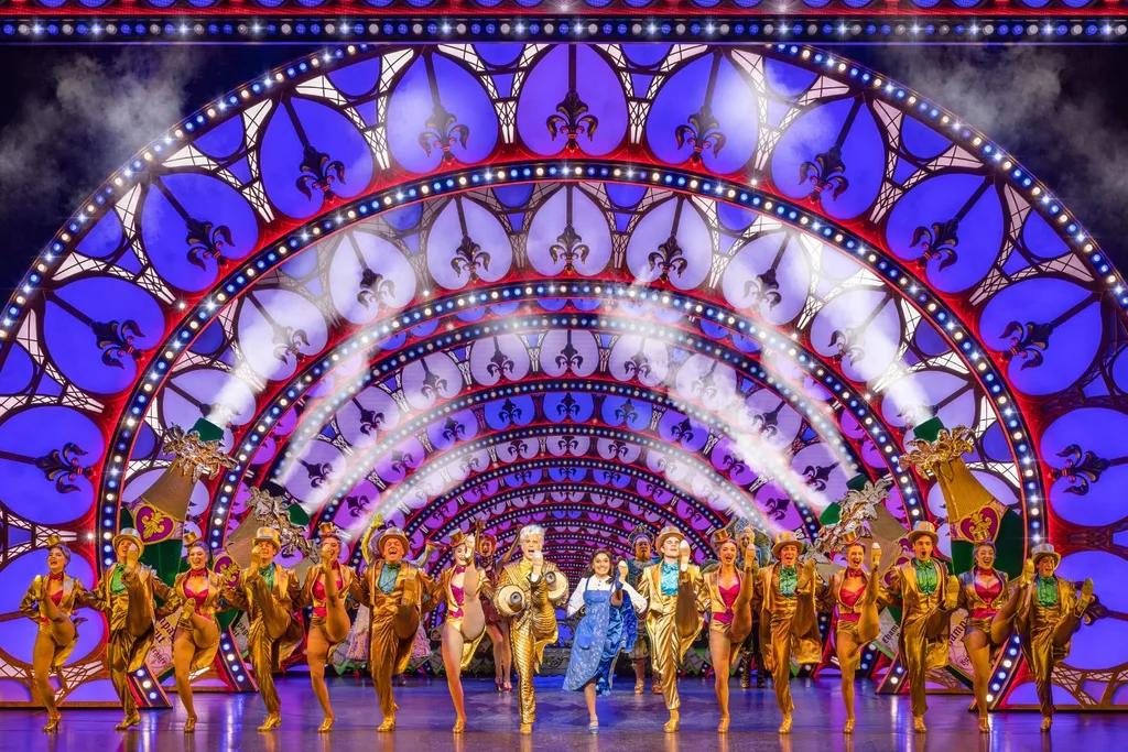 the beauty and the beast cast dancing on stage