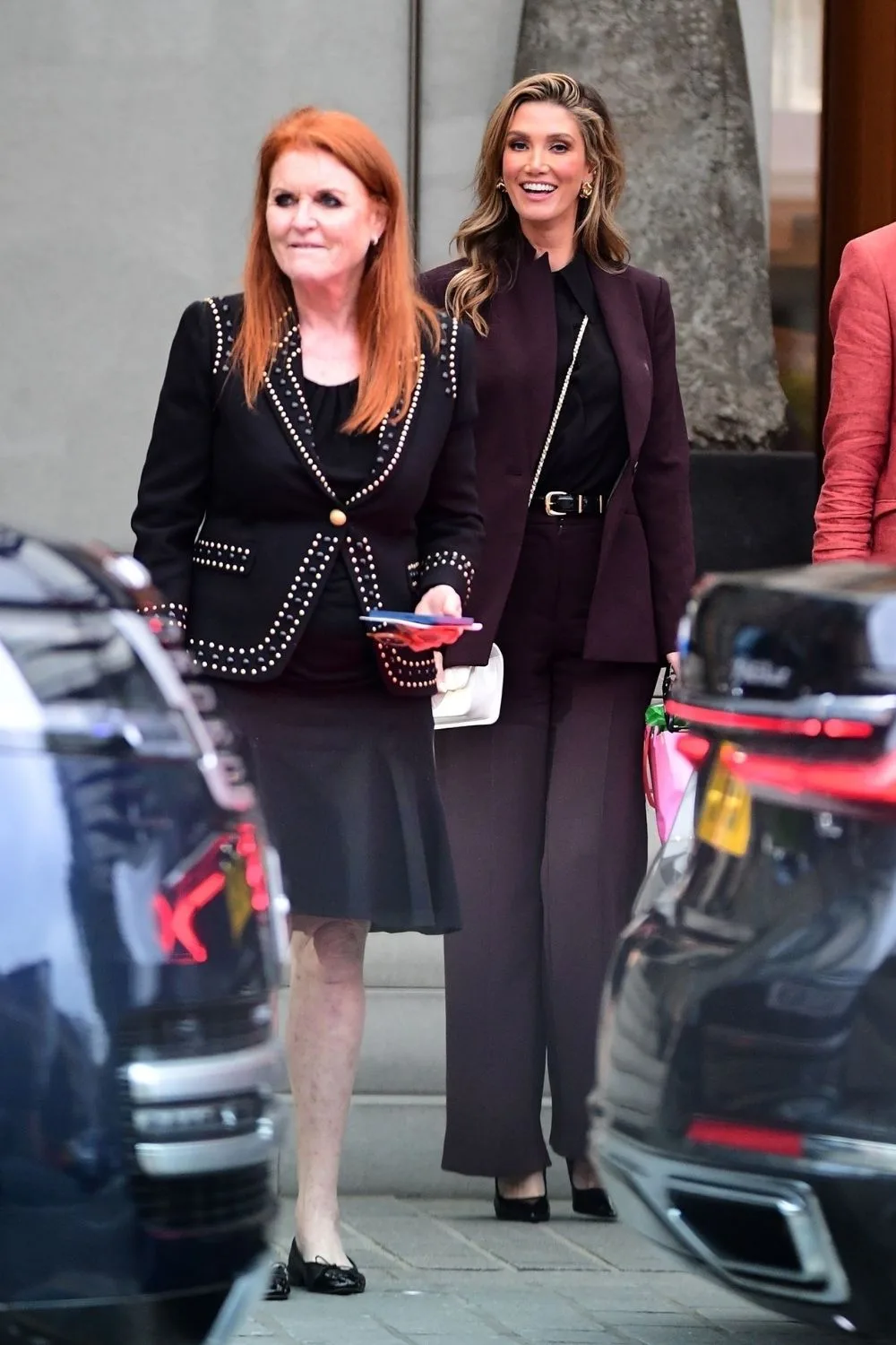 sarah ferguson and delta goodrem walk in the street together