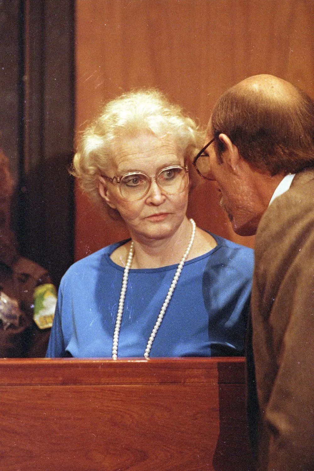 dorothea puente on court wearing big glasses and a long pearl necklace