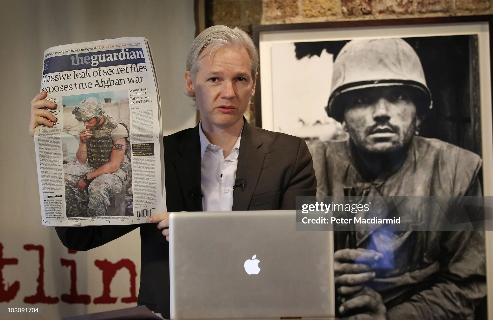 Julian Assange holding Wikileaks story
