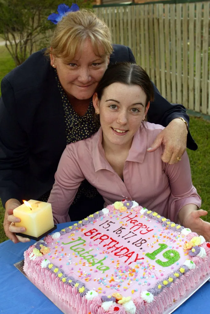 natasha ryan and her mother pose for a photo in from of a 19th birthday cake for natasha