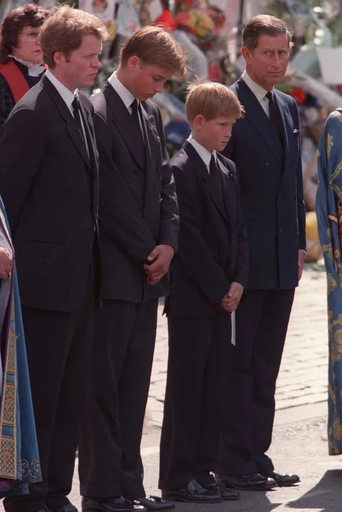 Charles Spencer, Prince William, Prince Harry and Prince Charles standing together outside Westminster Abbey during funeral of Princess Diana.