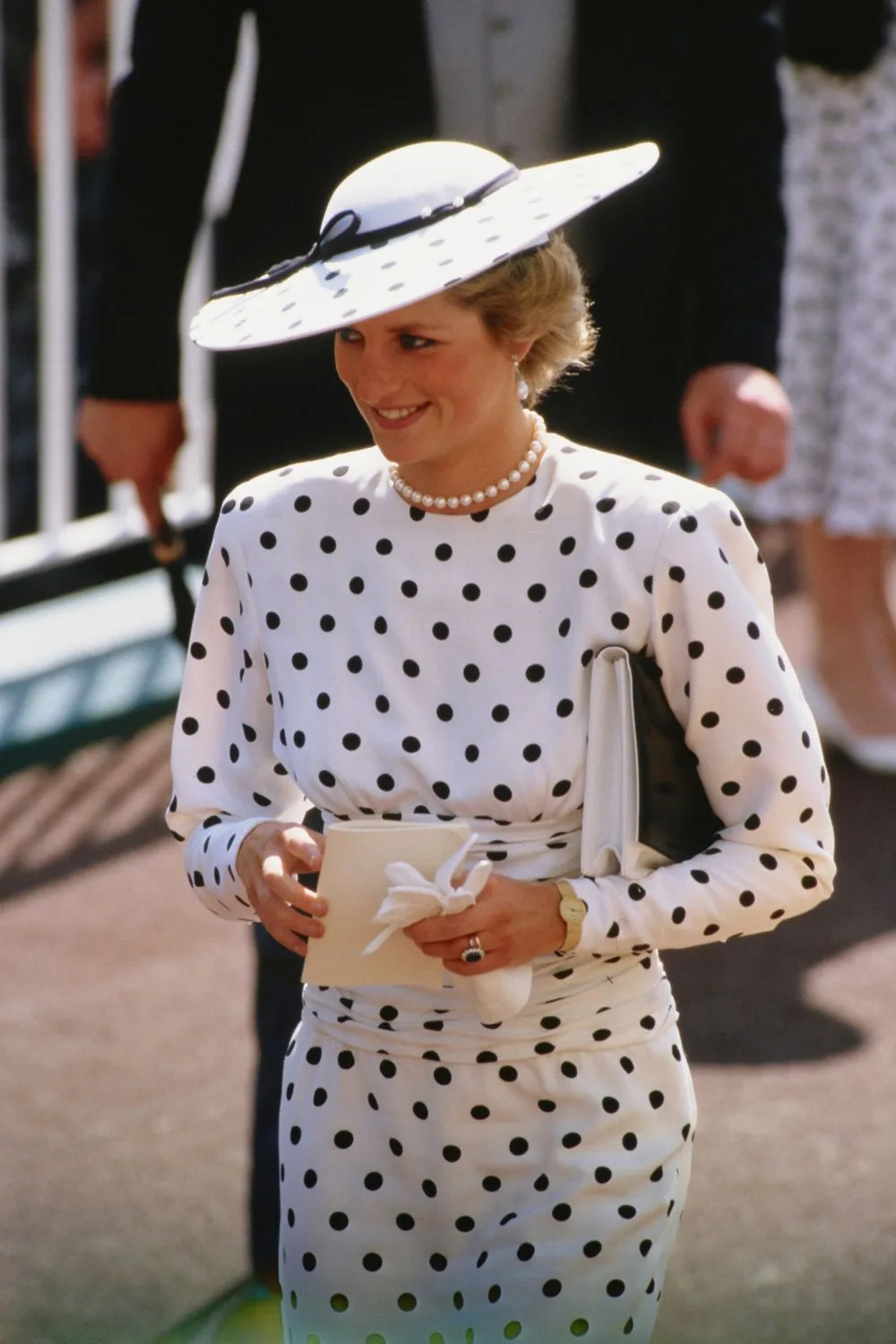 Princess Diana  wearing a black and white spotted dress at the royal ascot. 