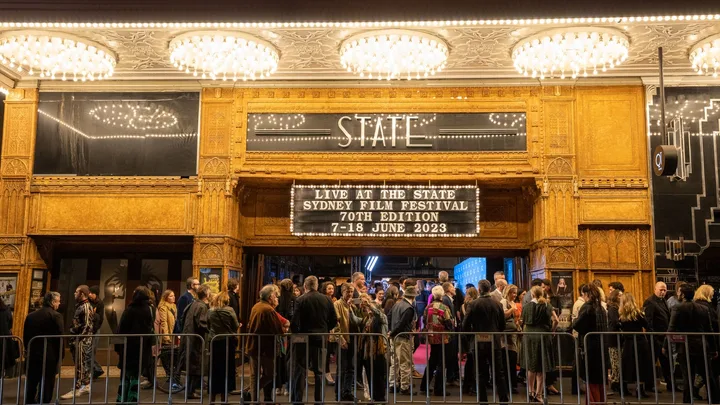 Crowd outside State Theatre for Sydney Film Festival 70th Edition, June 2023, under illuminated marquee.