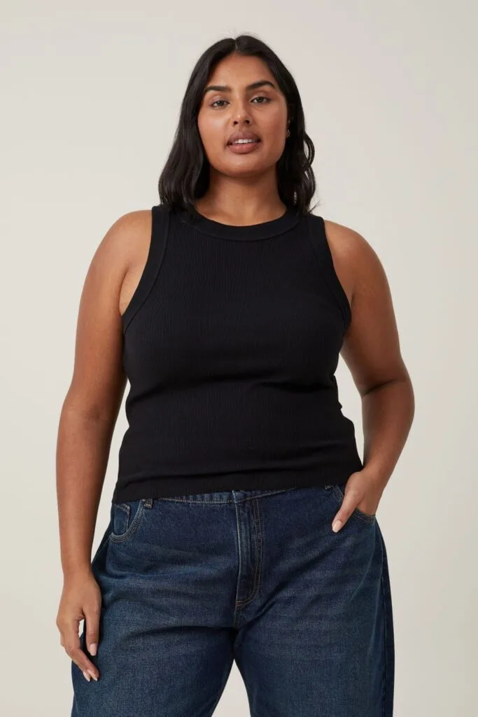 Model wearing Cotton On tank and jeans