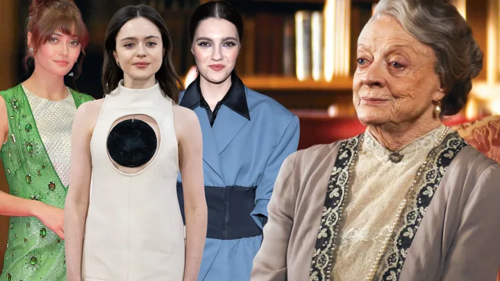 Four women in formal attire pose in front of a bookshelf backdrop.