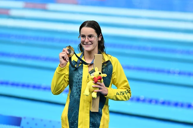 PARIS, FRANCE - JULY 30: Gold medallist Australia's Kaylee McKeown, silver medallist US' Regan Smith (not seen) and bronze medallist US' Katharine Berkoff (not seen) pose for a photo with their medals on the podium of the women's 100m backstroke swimming event during the Paris 2024 Olympic Games at the Paris La Defense Arena in Nanterre, west of Paris, France on July 30, 2024. (Photo by Mustafa Yalcin/Anadolu via Getty Images)