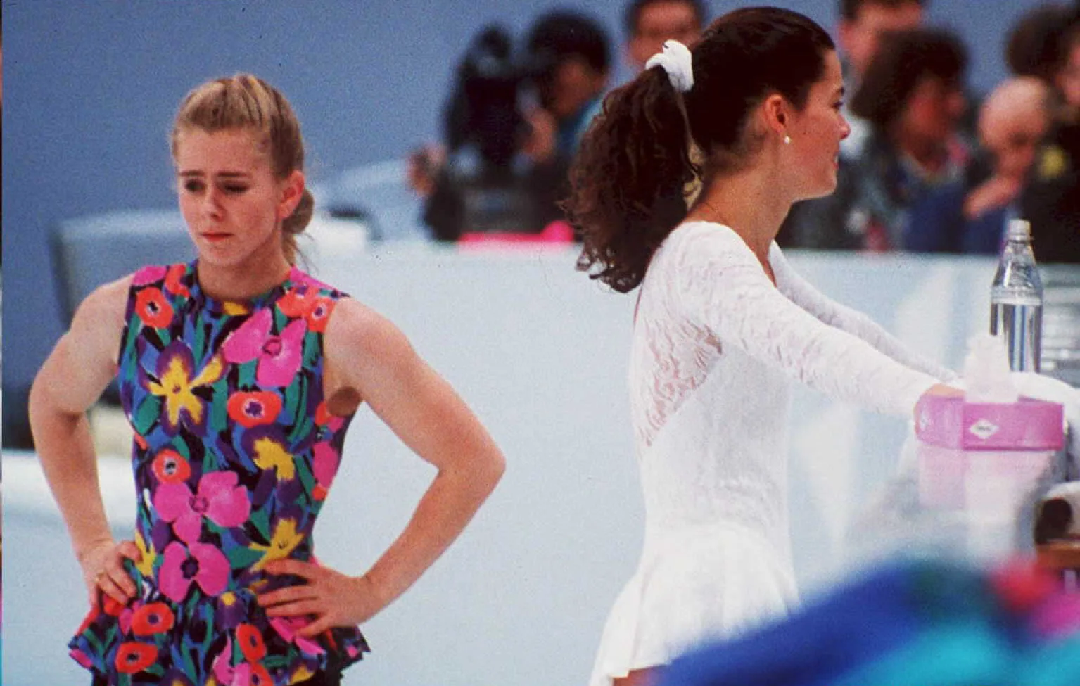 FILES, NORWAY - DECEMBER 15:  US figure skaters Tonya Harding (L) and Nancy Kerrigan avoid each other during a training session 17 February in Hamar, Norway, during the Winter Olympics. Kerrigan was hit on the knee in January 1994 during the US Olympic Trials and it was later learned that Harding's ex-husband and bodyguard masterminded the attack in hopes of improving Harding's chances at the US Trials and the Olympics. (COLOR KEY: Harding has yellow)  (Photo credit should read VINCENT AMALVY/AFP via Getty Images)