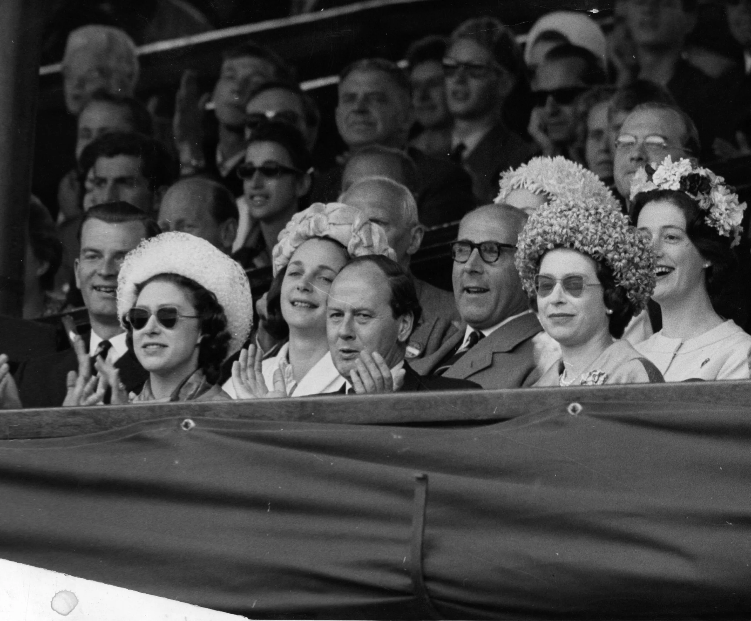 *Scanned low-res from print* Queen Elizabeth II and Princess Margaret watching the Men's singles final at Wimbledon. (Photo by PA Images via Getty Images)