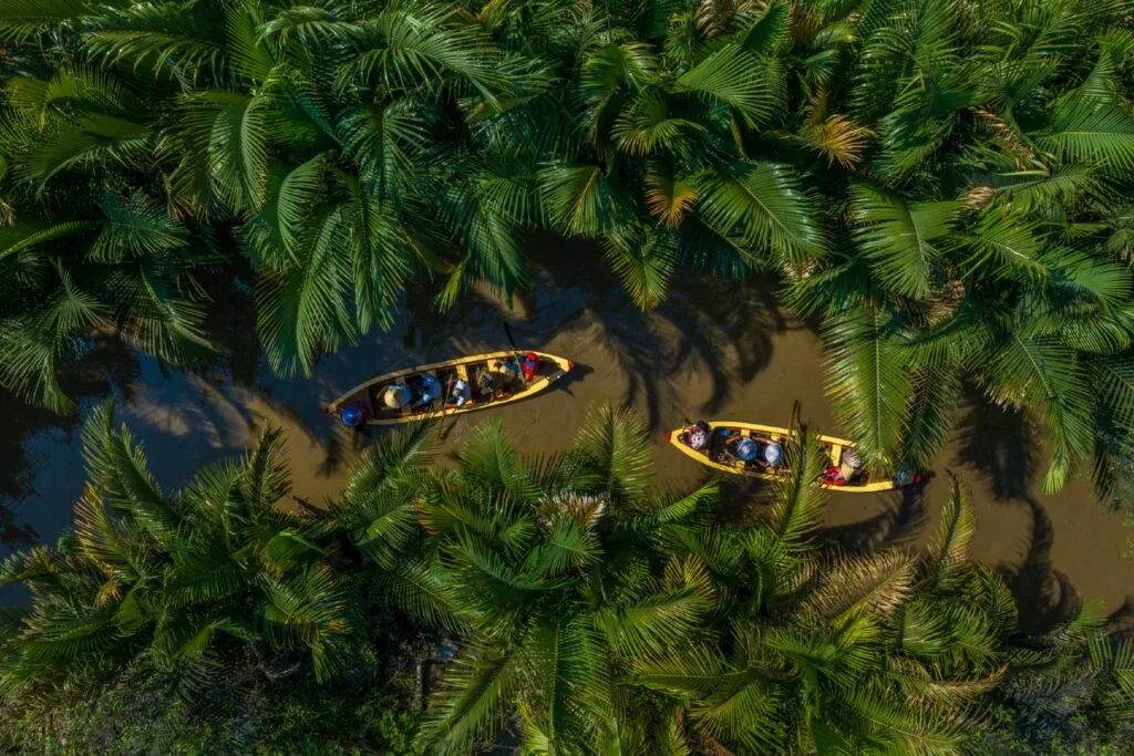 Tourists on river boats on the Mekong river in the tien giang province of Vietnam