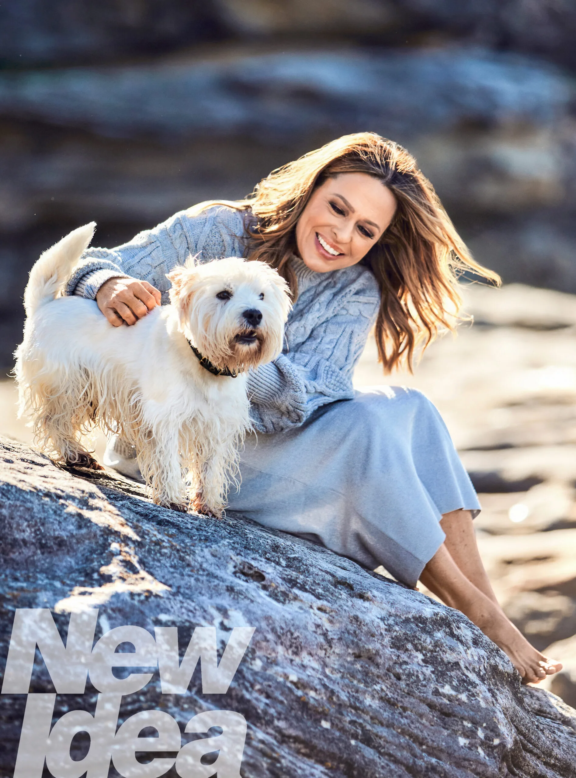 angela cox with her dog rafferty at tamarama beach
