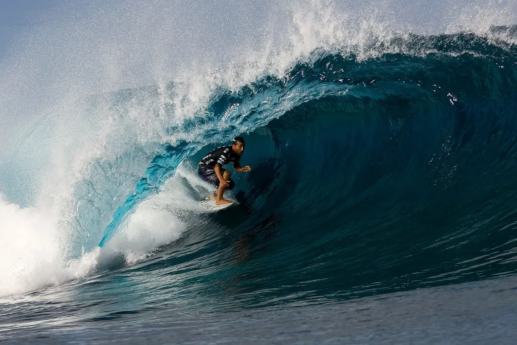 a man surfing in Teahupo’o