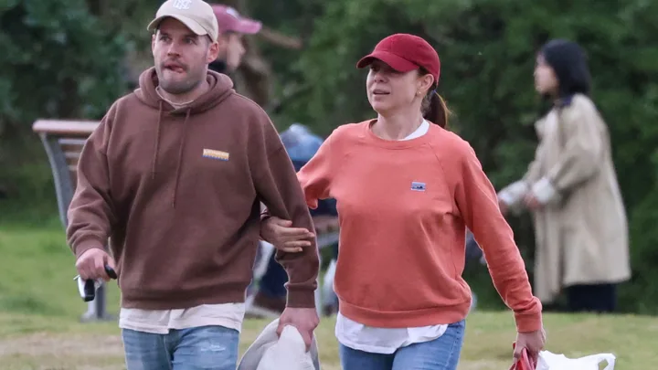 Kate Ritchie and new boyfriend Will walking in a park