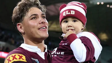 reece walsh with daughter leila wearing queensland state of origin uniform