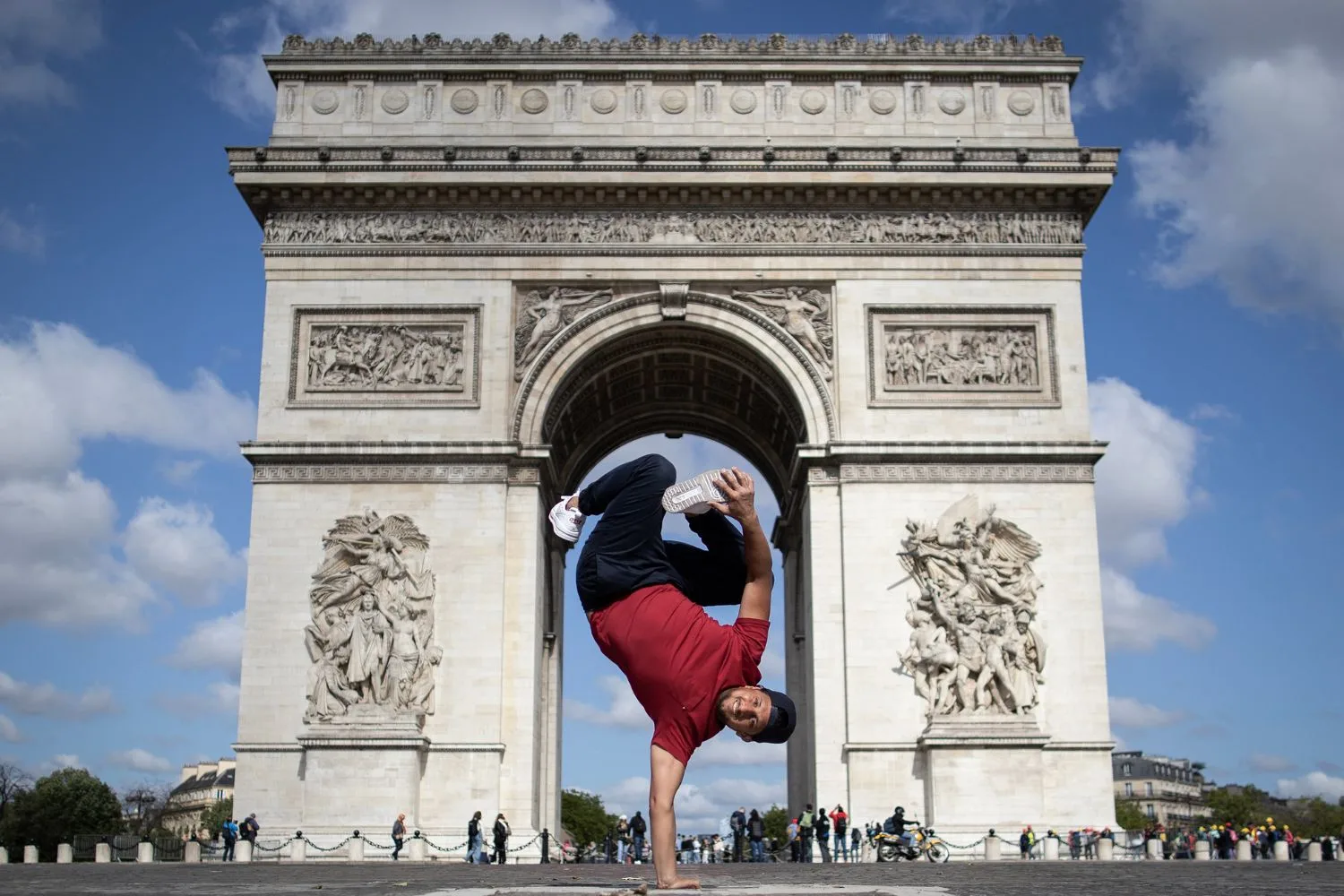B-Boy Mounir of France poses in front of the Arc de Triomphe.