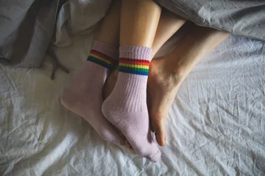 Couple in bed having intimate time together