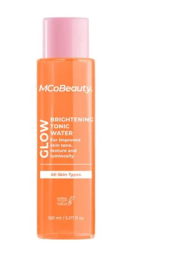 MCoBeauty Glow Brightening Tonic Water bottle with pink cap, promises improved skin tone and luminosity, suitable for all skin types.