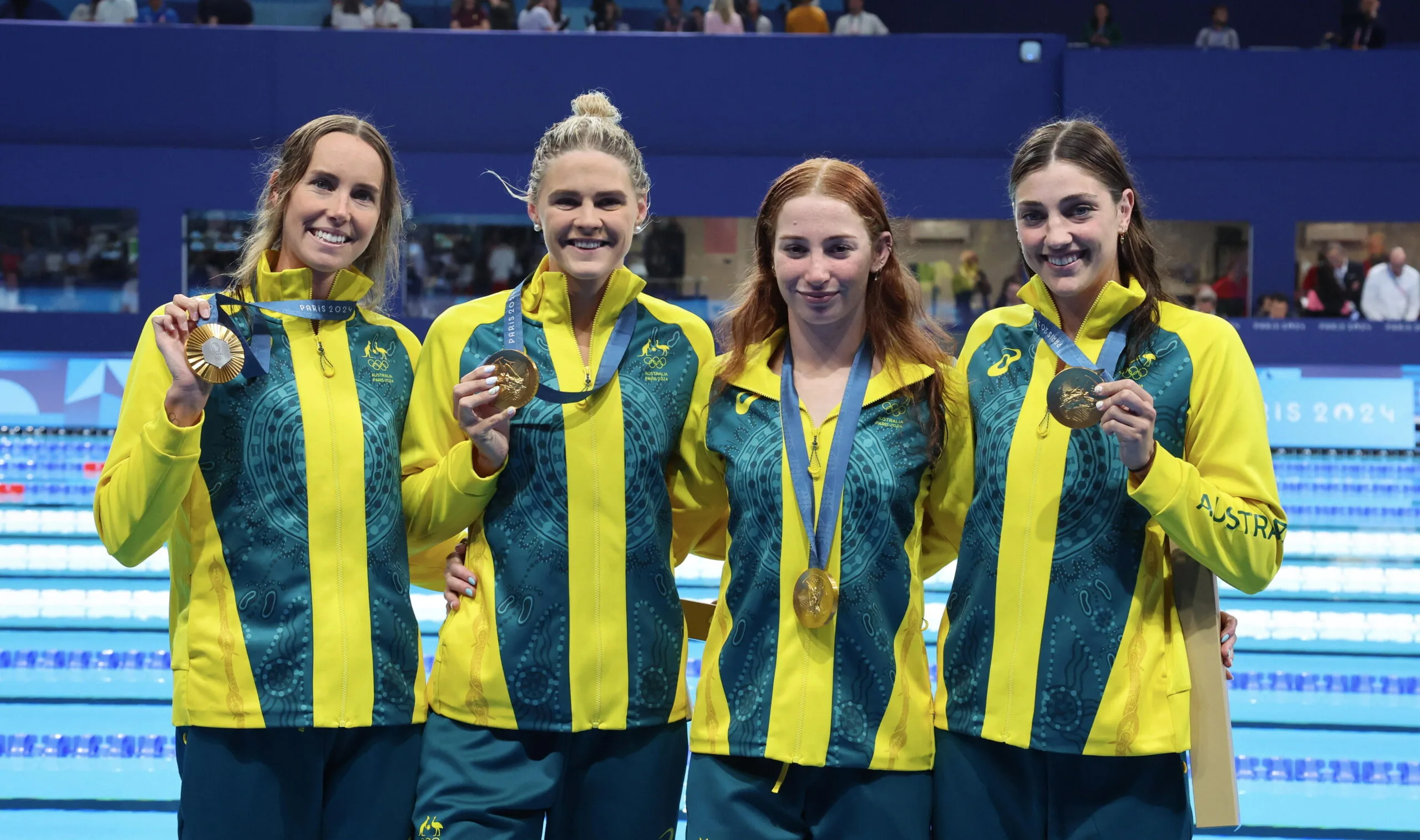 NANTERRE, FRANCE - JULY 27: Gold Medalists, Emma McKeon, Shayna Jack, Mollie O'Callaghan and Meg Harris of team Australia celebrate gold medal at the end of Women's 4x100m freestyle relay final on day one of the Olympic Games Paris 2024 at Paris La Defense Arena on July 27, 2024 in Nanterre, France (Photo by Xavier Laine/Getty Images)