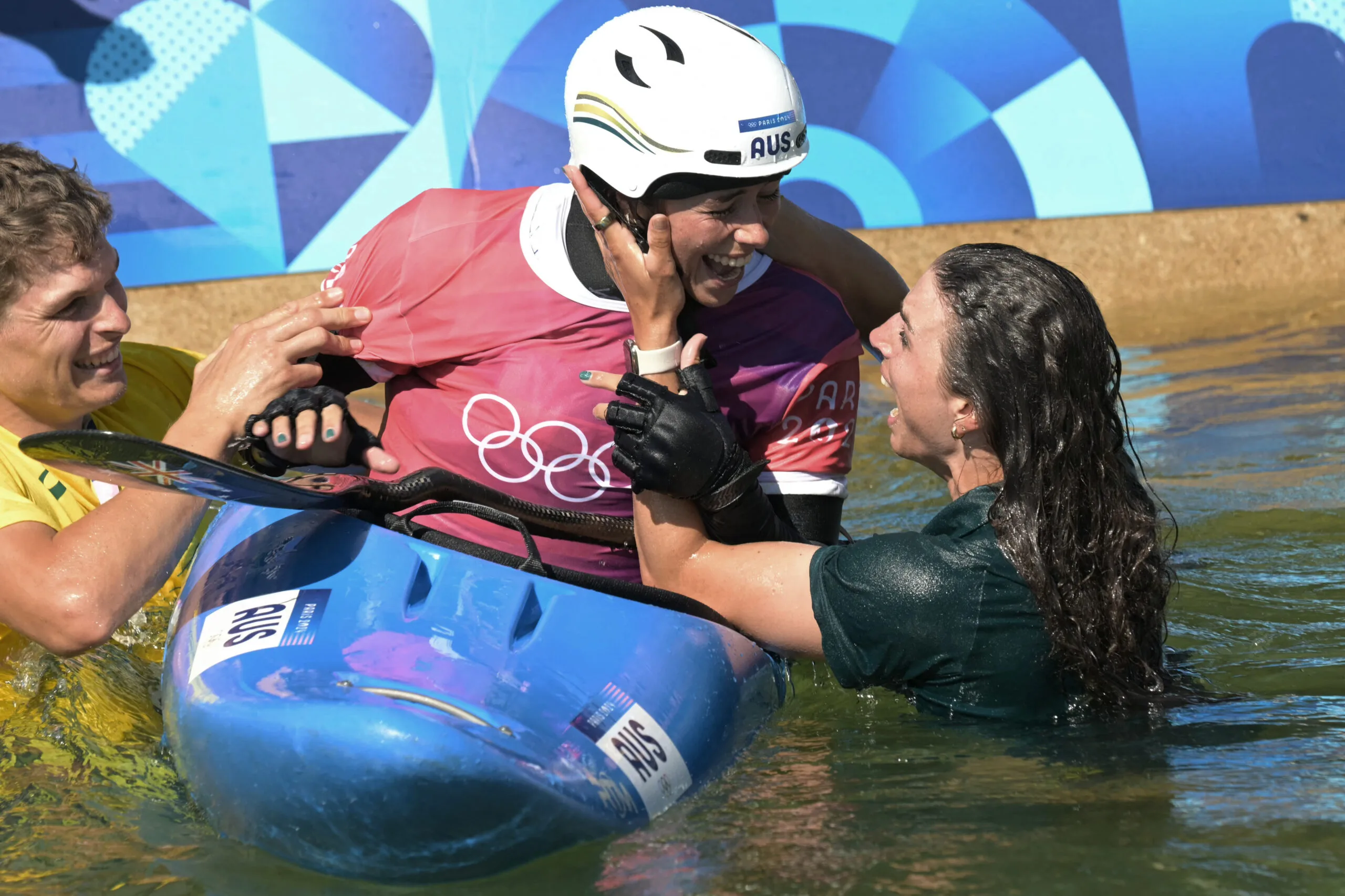 Australia's Jessica Fox (R) congratulates her sister Australia's Noemie Fox for winning in the women's kayak cross final of the canoe slalom competition at Vaires-sur-Marne Nautical Stadium in Vaires-sur-Marne during the Paris 2024 Olympic Games on August 5, 2024. (Photo by Bertrand GUAY / AFP) (Photo by BERTRAND GUAY/AFP via Getty Images)