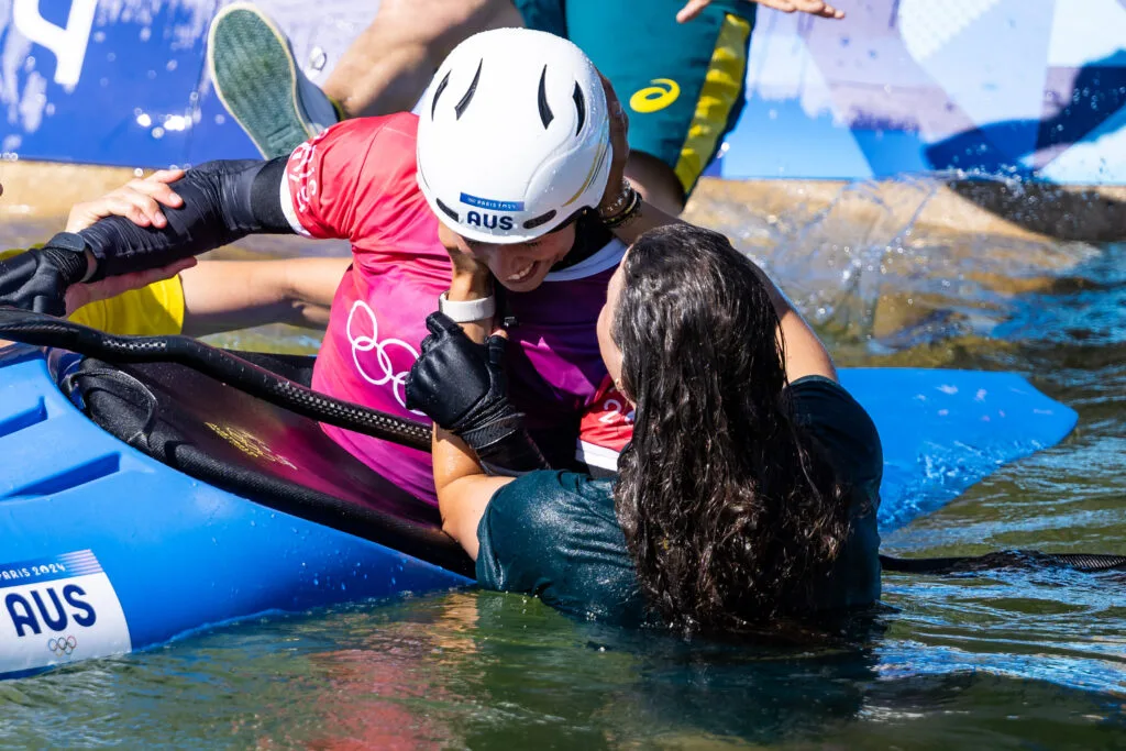 PARIS, FRANCE - AUGUST 5: Noemie Fox of Team Australia celebrates with Jessica Fox of Team Australia after winning gold in the Canoe Slalom Women's Kayak Cross final on day ten of the Olympic Games Paris 2024 at Vaires-Sur-Marne Nautical on August 5, 2024 in Paris, France. (Photo by Kevin Voigt/GettyImages)