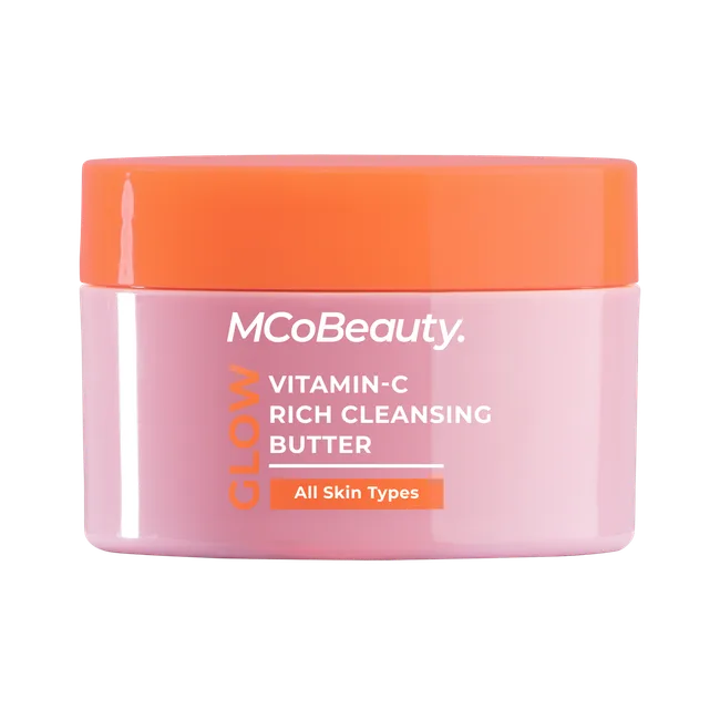 MCoBeauty Glow Vitamin-C Rich Cleansing Butter jar with orange lid for all skin types.