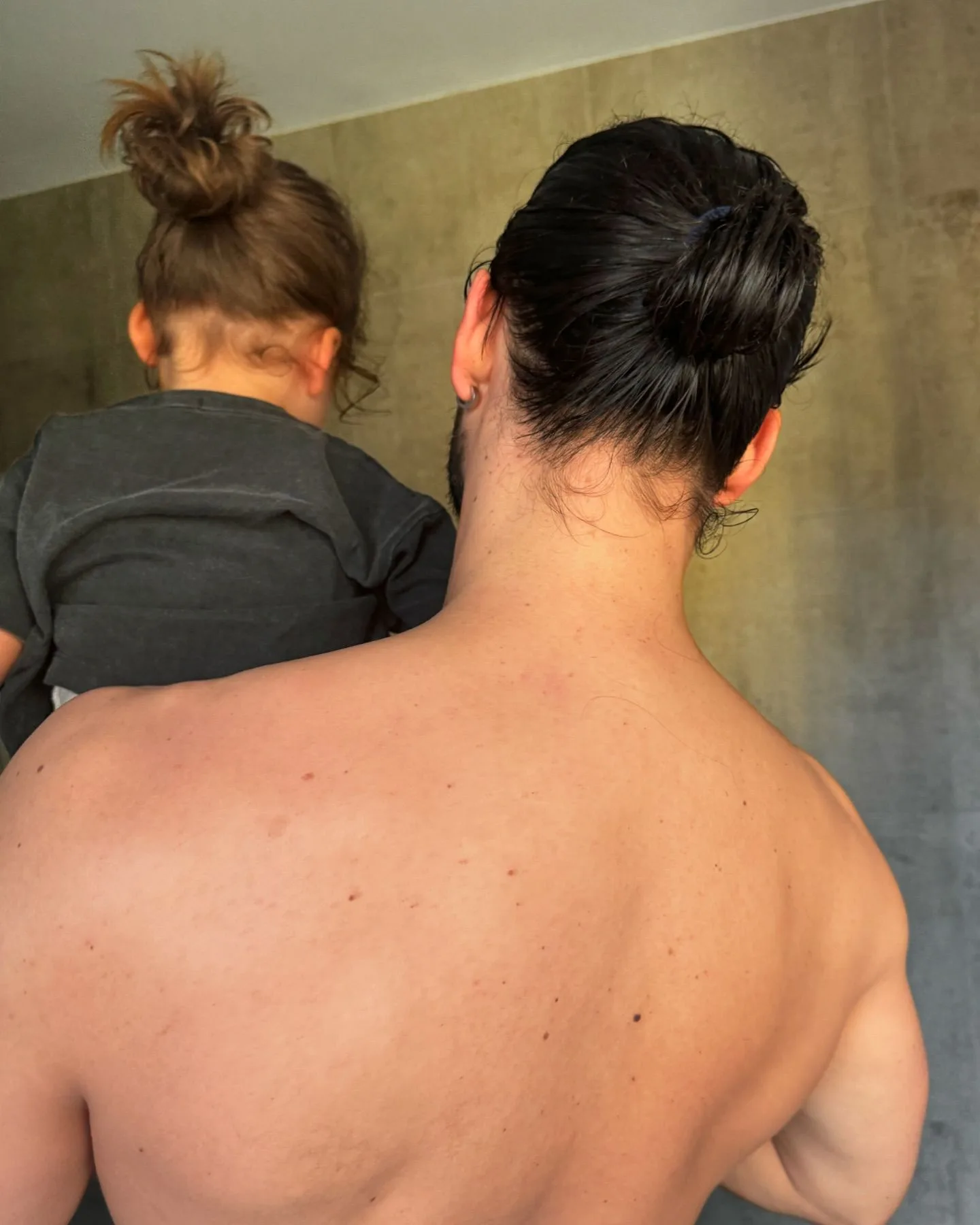 michael brunelli and son lucius with matching man buns