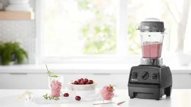 Vitamix Experian blender with a pink fruity smoothie