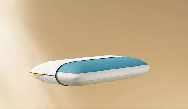 A memory foam pillow with a blue and white design on a beige background.