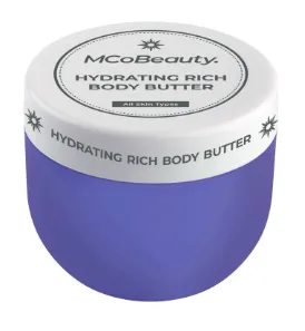 Hydrating rich body butter in a purple jar with a white lid, labeled "MCoBeauty" for all skin types.