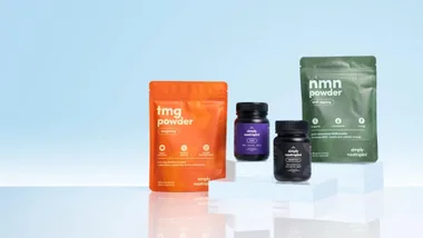 "Packs of TMG powder, NMN powder, and bottles of Simply Nootropics supplements on a light blue background."