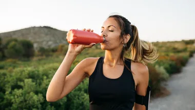 woman drinking water bottle