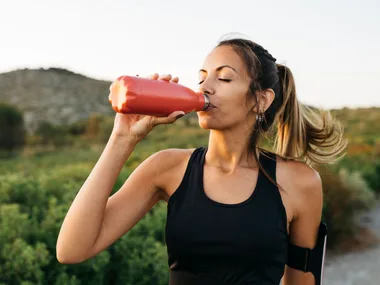 woman drinking water bottle