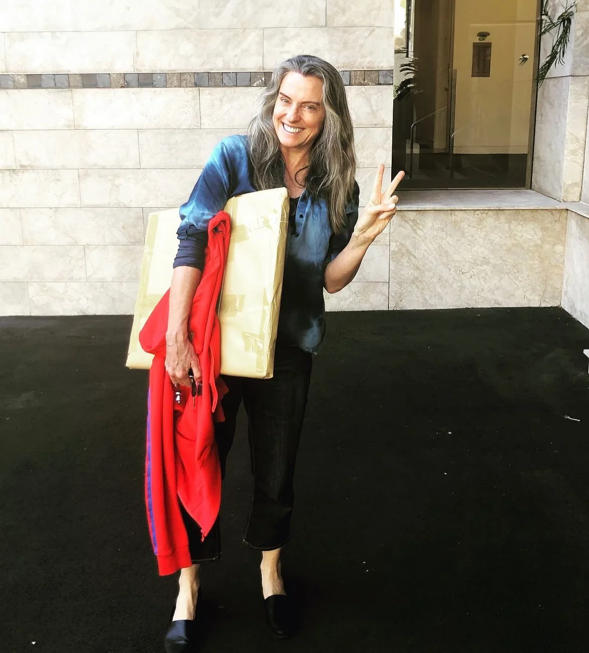 Gretel Killeen holding a parcel