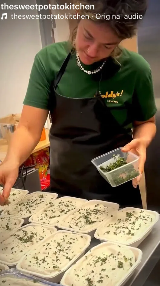 Emmy preparing meals in kitchen