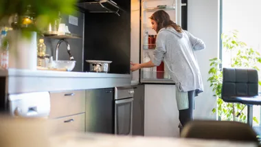 woman opening the fridge