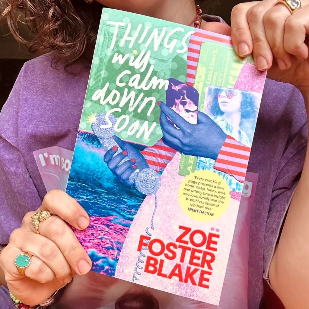 Things Will Calm Down Soon book cover, held by Zoe Foster Blake.