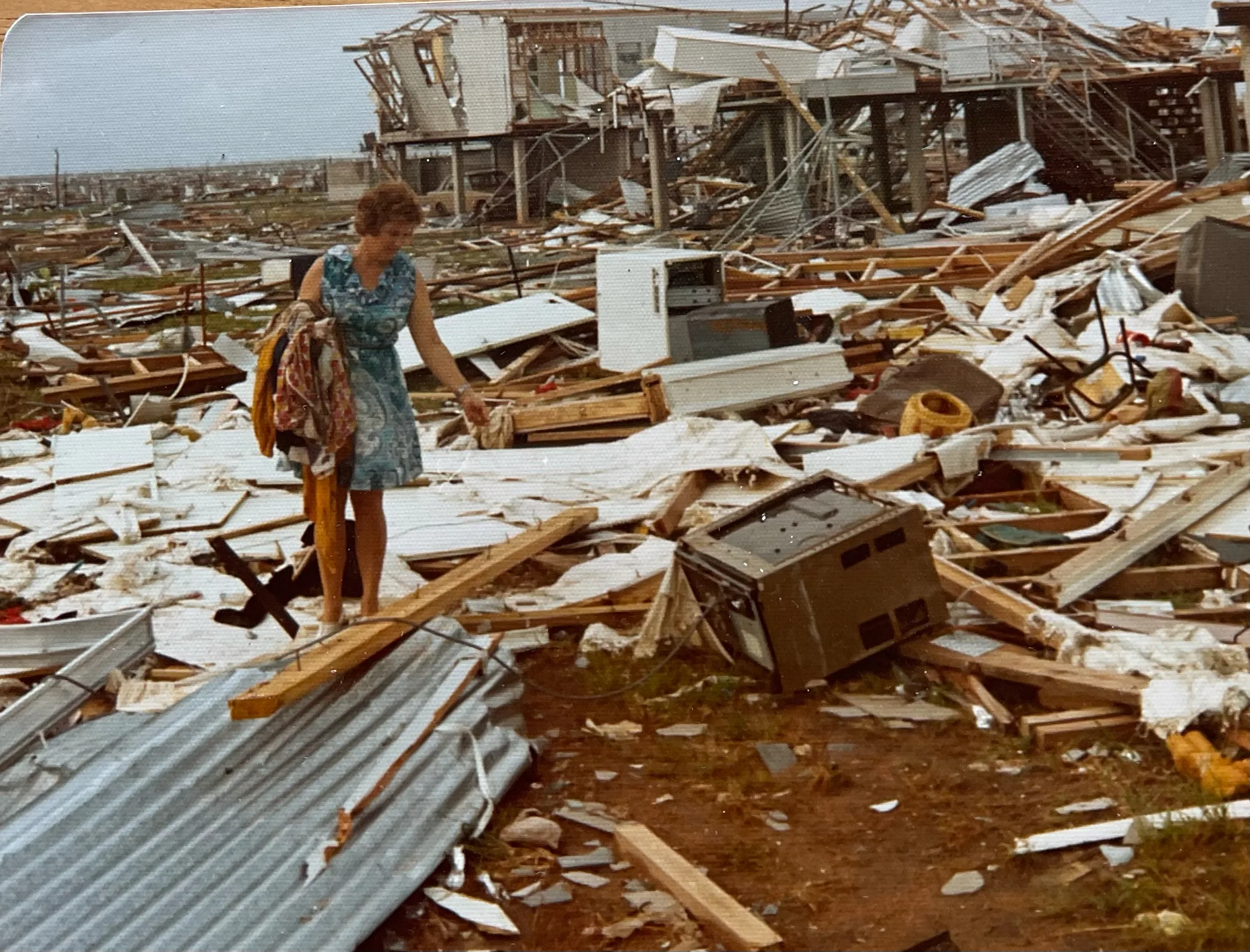 Pam's mother searches through rubble