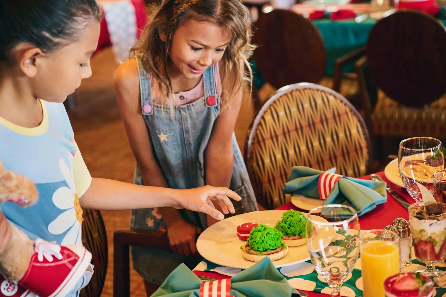 Two kids enjoying the Dr seuss breakfast on carnival cruise line